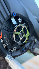 Metal motor cover V1 for Talaria XXX — installed detail on chain drive