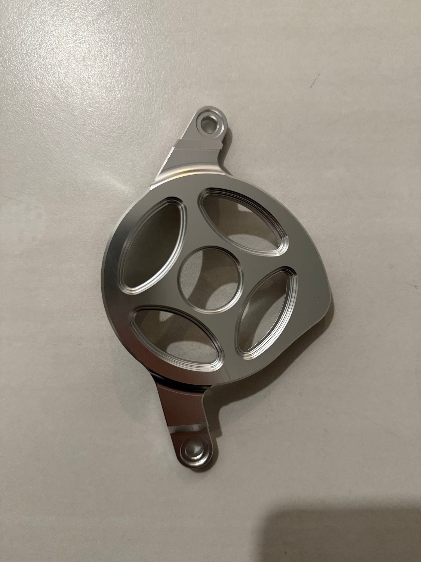 Metal motor cover V2 for Talaria XXX — anodized black finish detail
