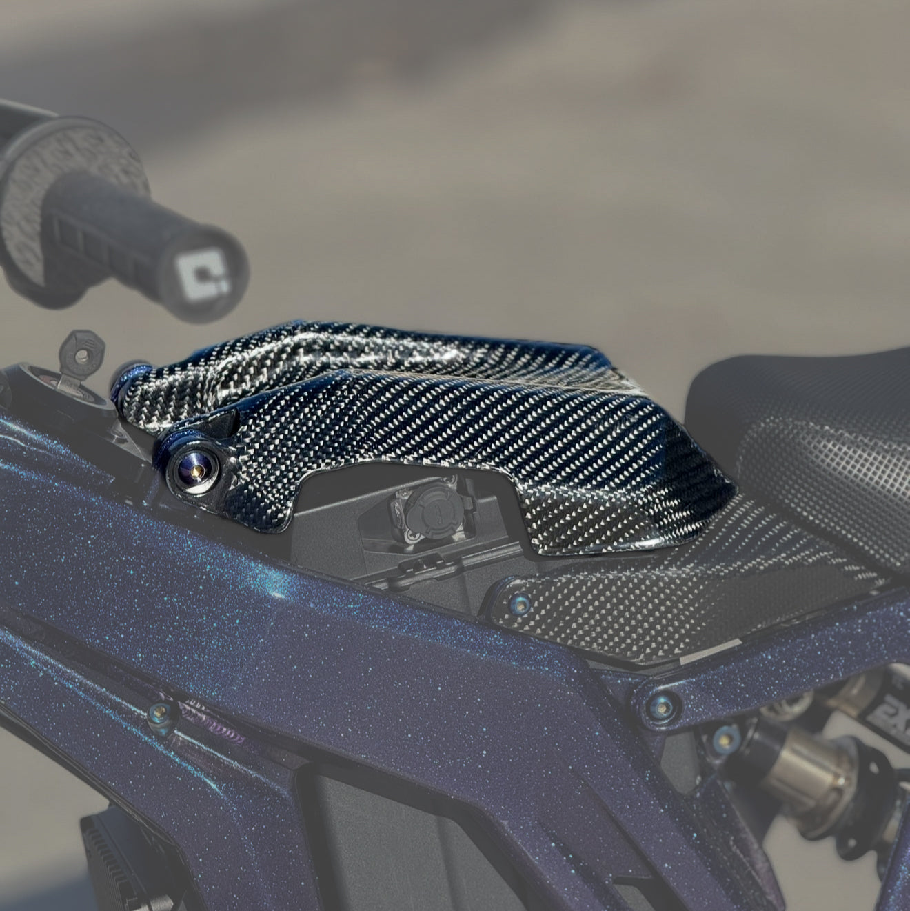 E-Ride Pro Carbon Fiber Battery Lid — carbon weave front view