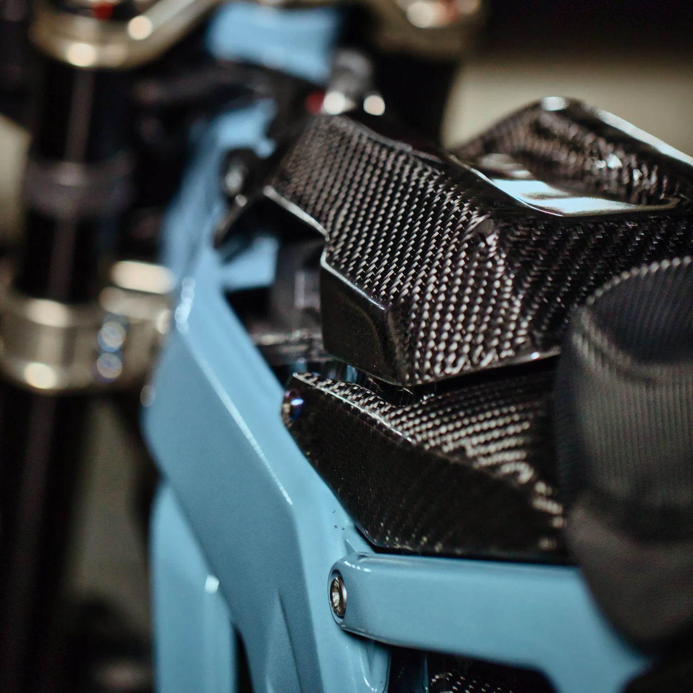 E-Ride Pro Carbon Fiber Battery Lid Lock — side profile installed view