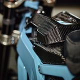 E-Ride Pro Carbon Fiber Battery Lid Lock — side profile installed view
