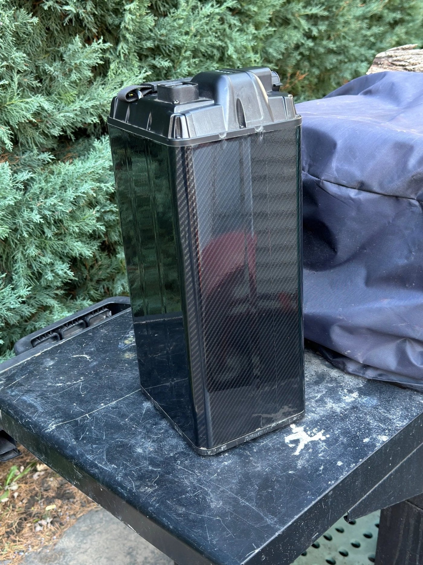 Carbon fiber battery wrap for Surron and Talaria — far corner view
