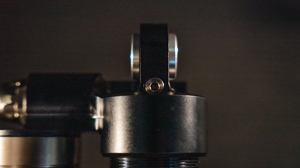 EXT REA MX rear shock for Surron Ultra Bee — mount eyelet detail