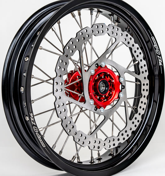 Warp 9 17-inch front supermoto wheel for mid-late 2010 Honda CRF — 320mm rotor with red anodized hub
