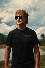 Front view of the Throttle Co Electric Dirt Bike Barcode Tag Tee in black, showing the tonal blackout THROTTLECO chest print