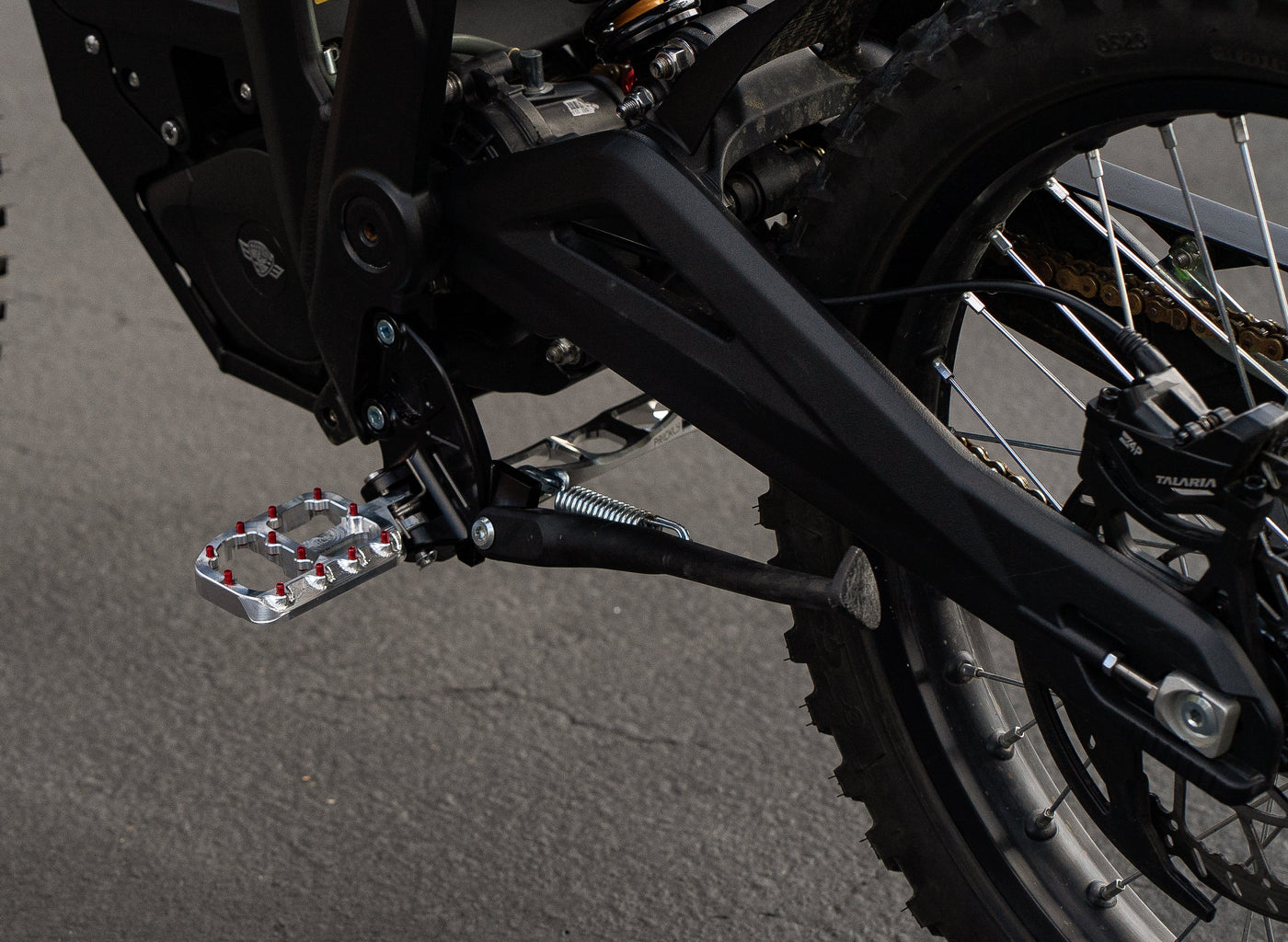 Footpeg Brackets for Talaria Sting — billet brackets installed detail