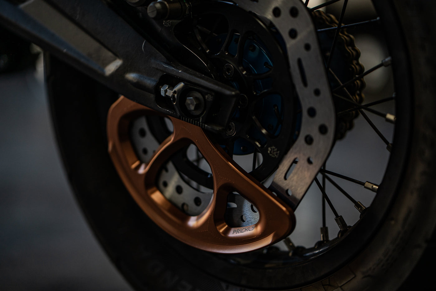 Prickly Disc Guard Fin for Surron — installed rotor protection detail