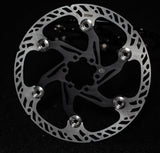 Prickly 220mm floating rotor for Surron — billet carrier detail
