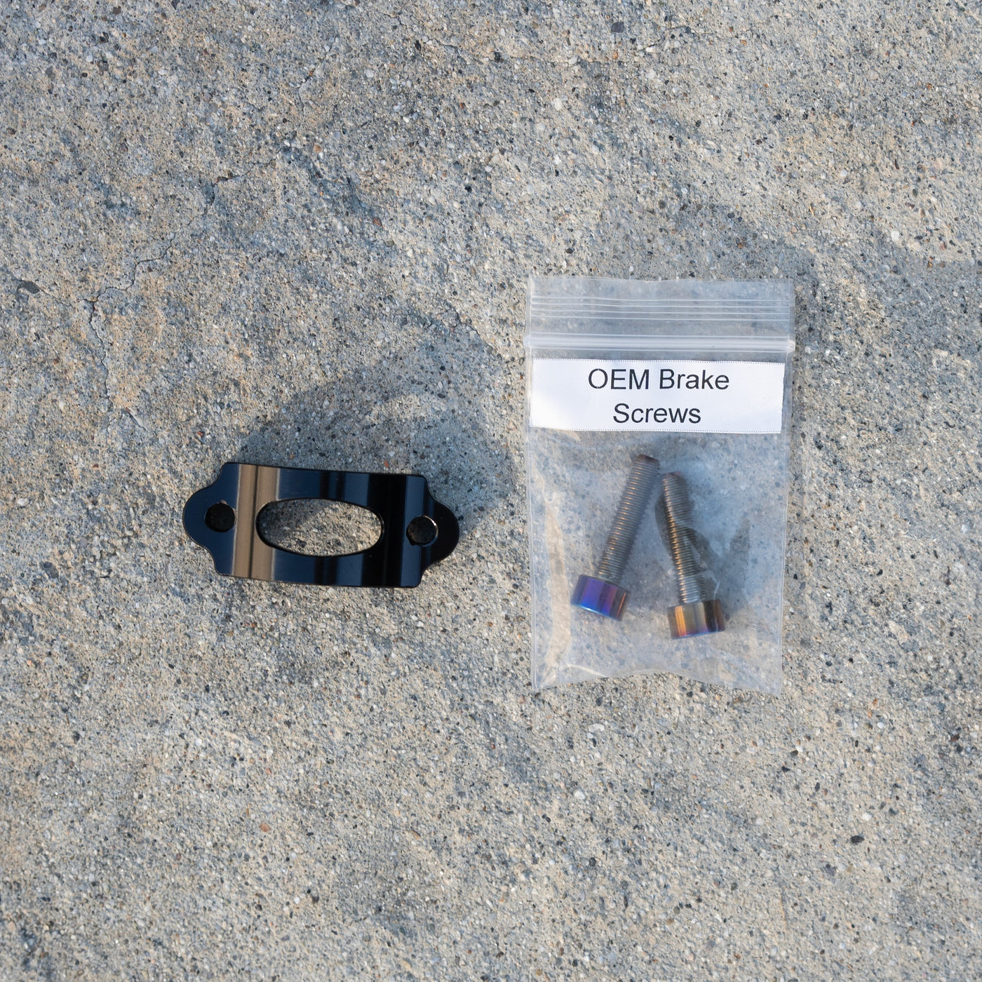 OEM brake screws and black cable bracket included with Warp 9 V2 high-output headlight kit
