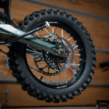 Warp 9 Ultra Bee disc guard — installed on Surron Ultra Bee rear brake protection