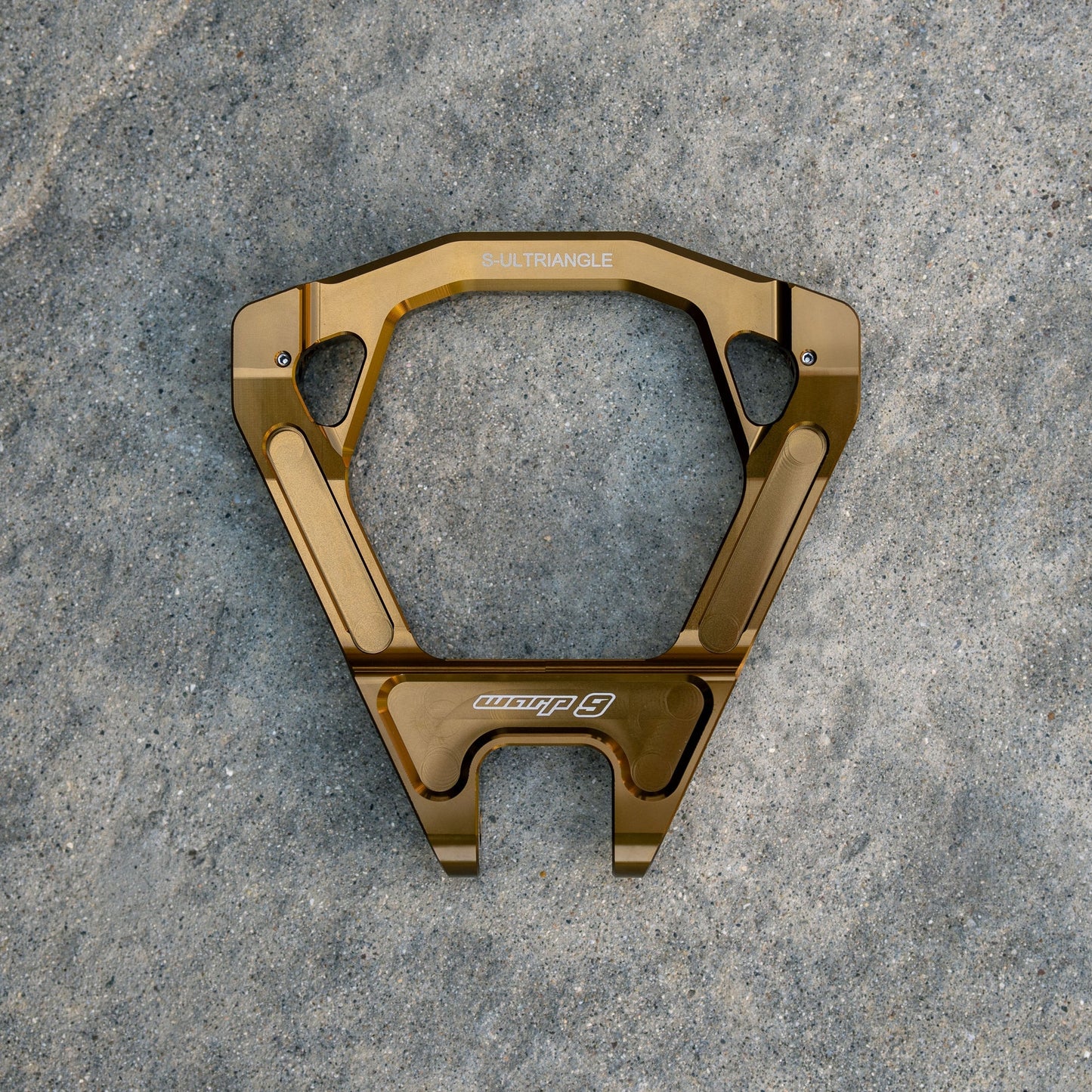 Warp 9 forged suspension linkage triangle for Surron Ultra Bee — grease zerk fitting detail