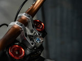 Prickly Stem Lock for Surron LBX — direct mount stem headset lock install detail
