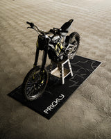 Prickly Bike Mat for Surron and Talaria — looped-fabric top that rolls up for transport