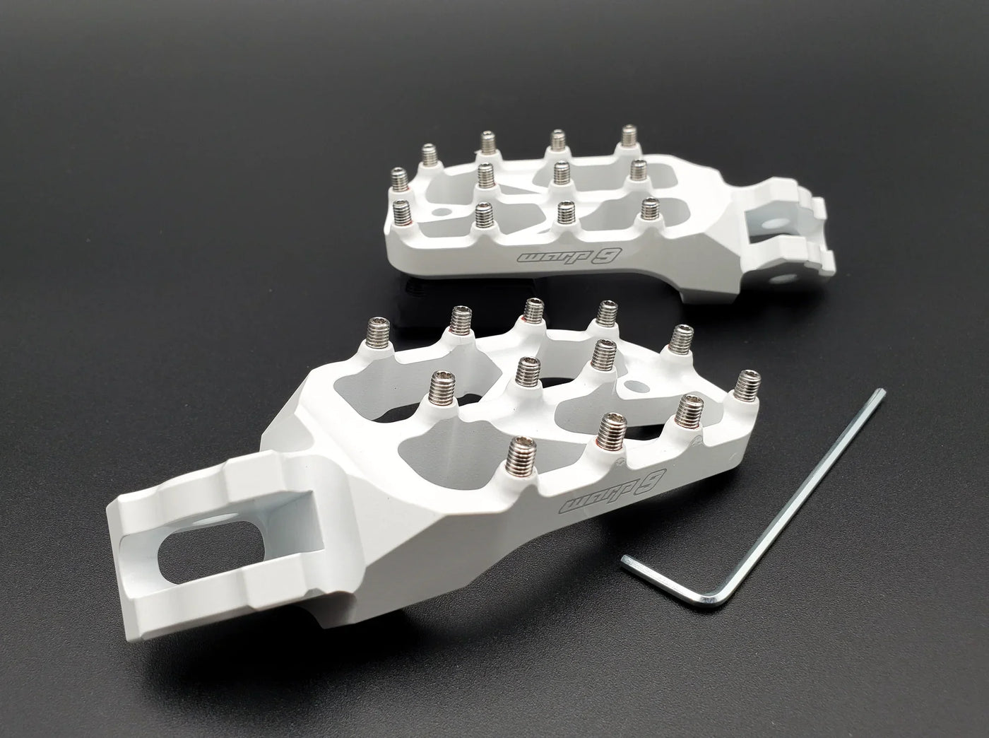 Warp 9 E-Moto Elite Foot Pegs — installed on Surron LBX side view