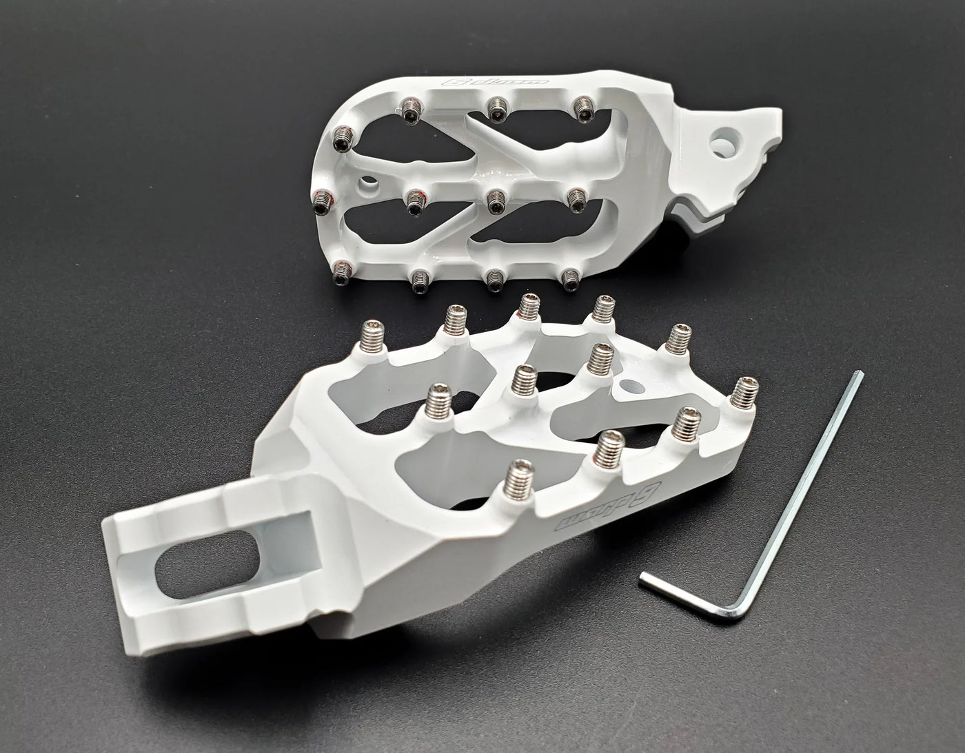 Warp 9 E-Moto Elite Foot Pegs for Surron LBX and E-Ride Pro — forged 7075-T6 aluminum with stainless replaceable teeth