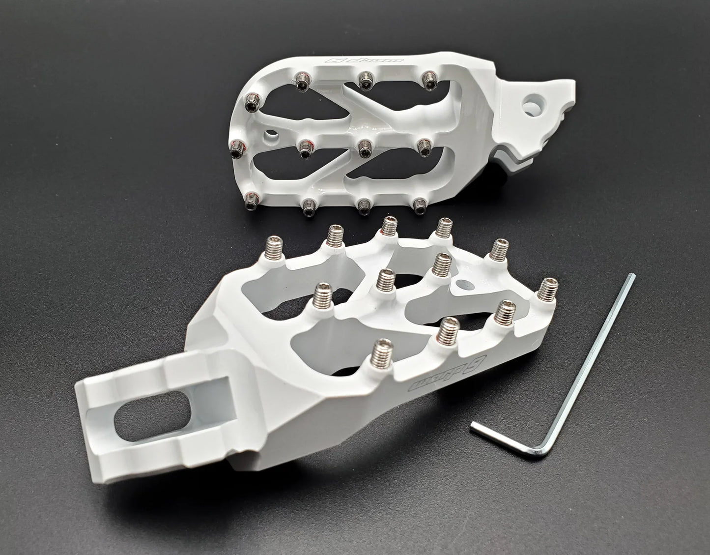 Warp 9 E-Moto Elite Foot Pegs for Surron LBX and E-Ride Pro — forged 7075-T6 aluminum with stainless replaceable teeth