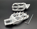 Warp 9 E-Moto Elite Foot Pegs for Surron LBX and E-Ride Pro — forged 7075-T6 aluminum with stainless replaceable teeth