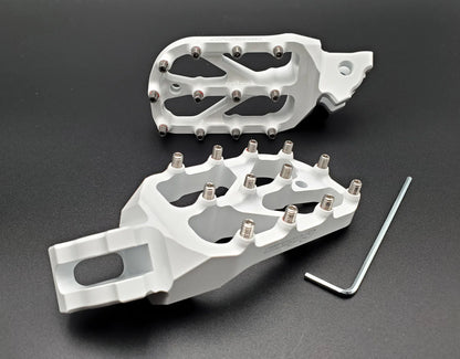 Warp 9 E-Moto Elite Foot Pegs for Surron LBX and E-Ride Pro — forged 7075-T6 aluminum with stainless replaceable teeth