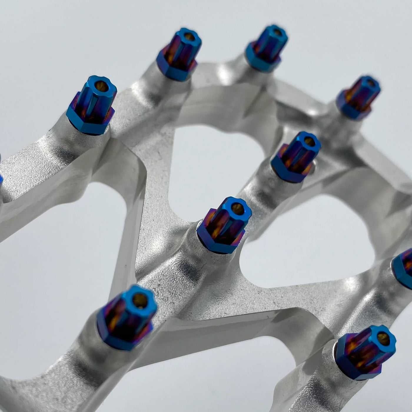 Warp 9 Titanium Torx Peg Screws for Surron — installed on Elite foot peg