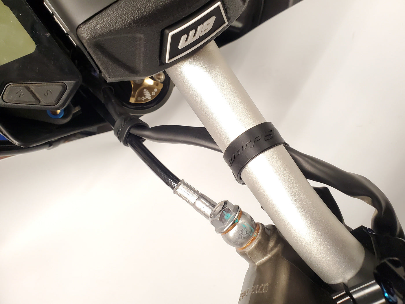Warp 9 Bar Straps for Surron & Talaria — close-up buckle detail