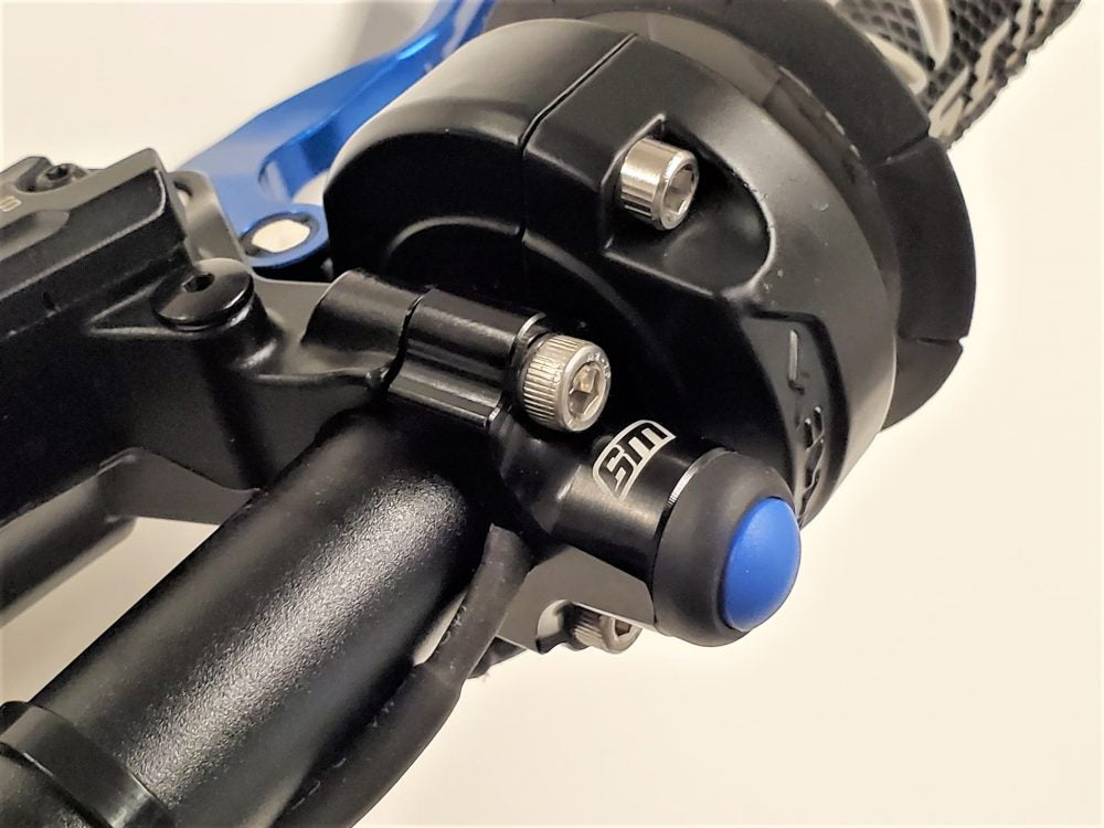 Warp 9 Light Button for Surron Light Bee X — installed on handlebar