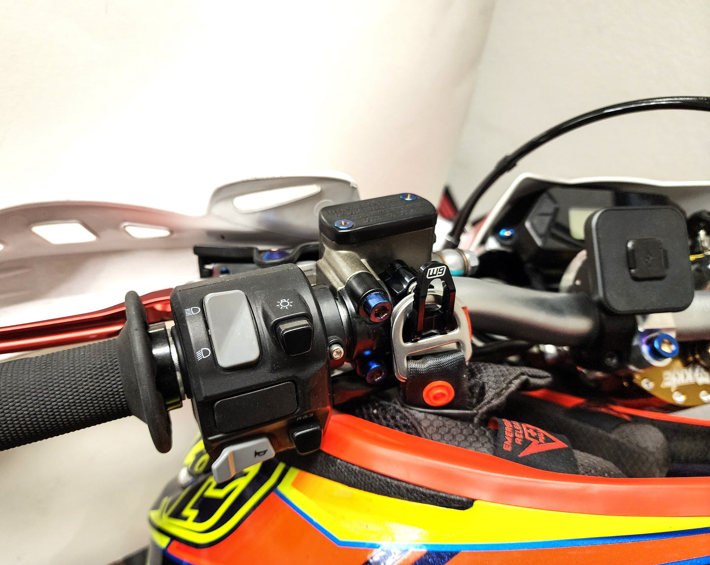 Warp 9 Helmet Hook for Surron Light Bee X — installed on handlebar