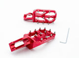 Warp 9 Ultra Bee Elite Foot Pegs installed on Surron e-moto