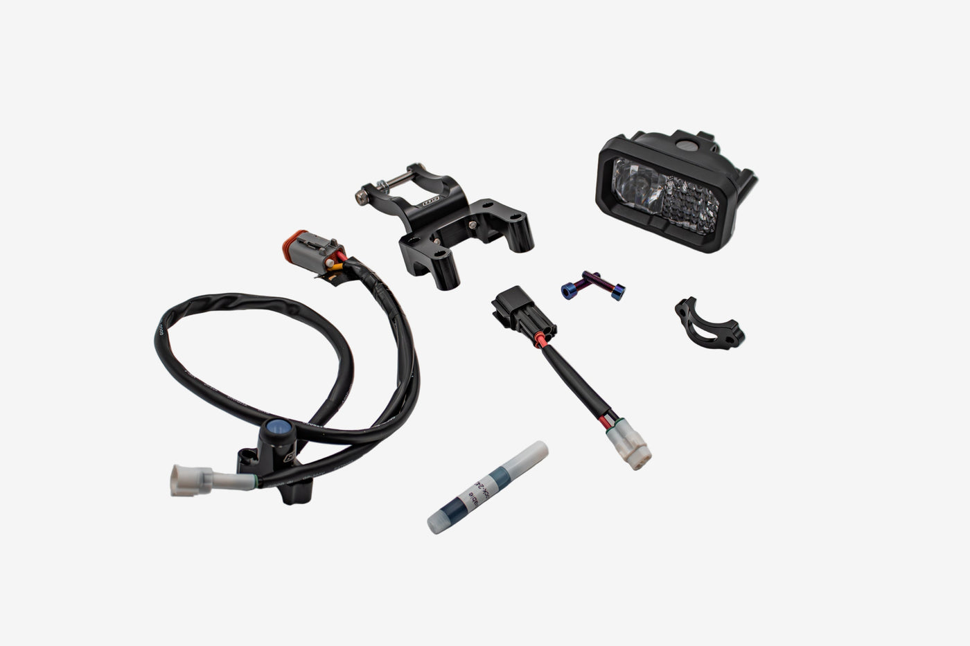 Warp 9 V2 LED headlight components — headlight body, W9 mounting bracket, wiring harness, and connector hardware on white background
