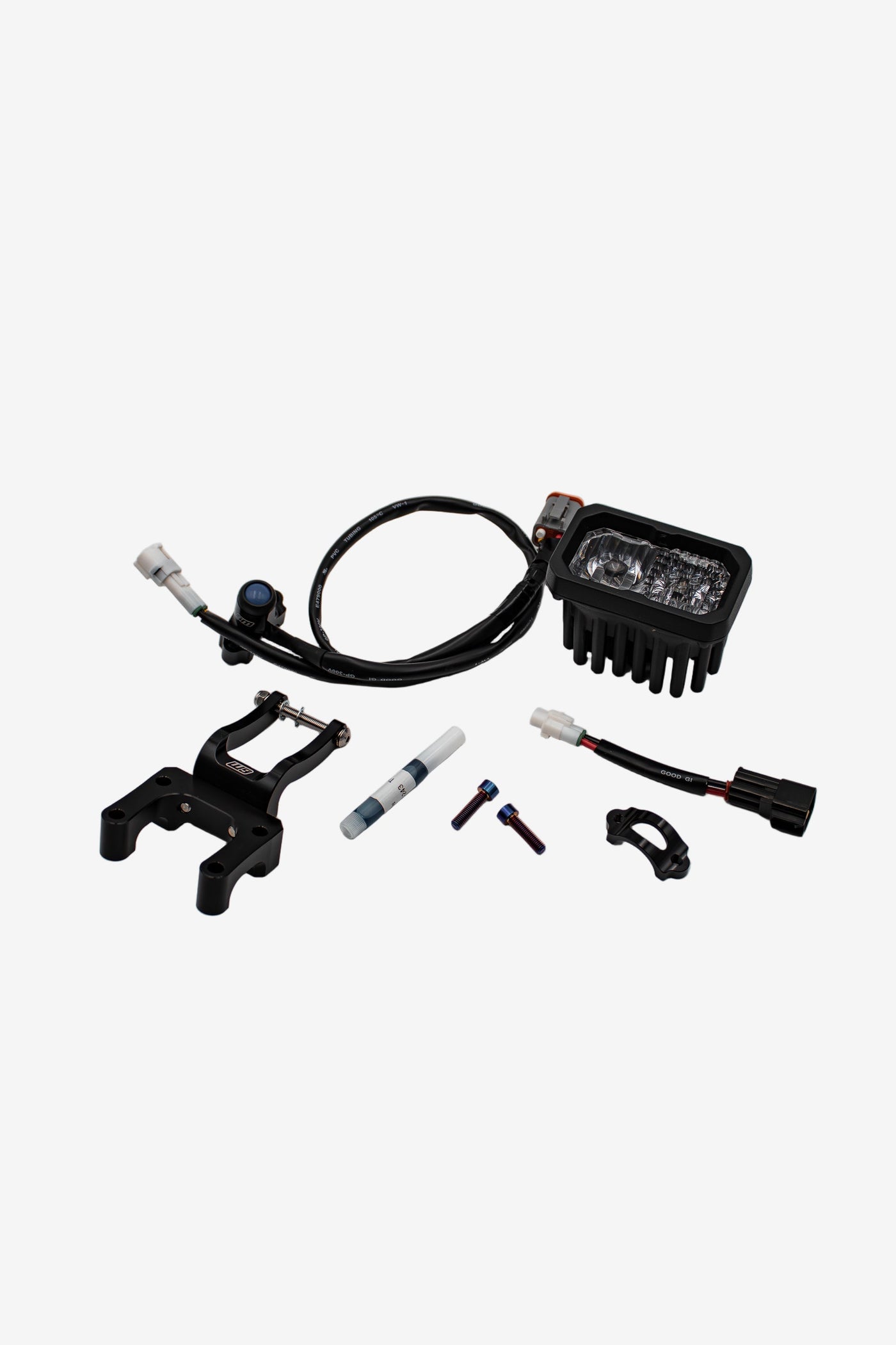 Warp 9 V2 headlight kit — LED light, W9 fork clamp bracket, wiring harness with button, titanium bolts, and cable guide
