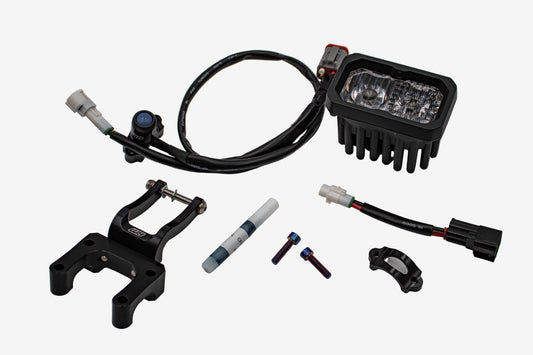 Warp 9 V2 high-output LED headlight kit with W9 mounting bracket, wiring harness, and hardware for Surron and Talaria
