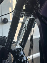 Adjustable Fork Saver — installed set on e-moto front fork pair