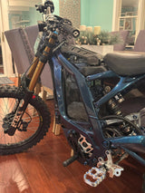 E-Bike invisible Vantablack battery wrap — installed on Surron frame top view