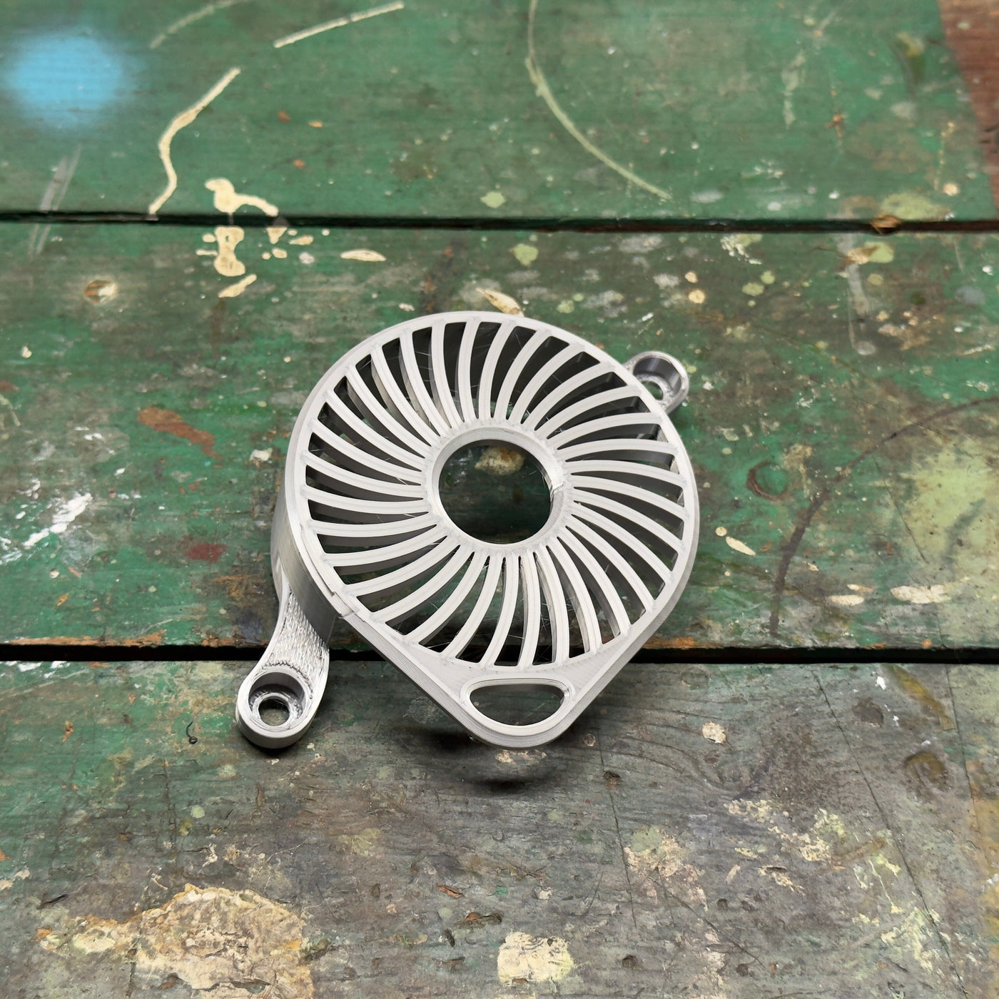 Surron LBX motor cover flat lay – full profile view showing mounting points
