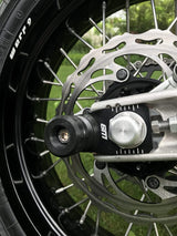 Rear axle slider for e-motos — black anodized