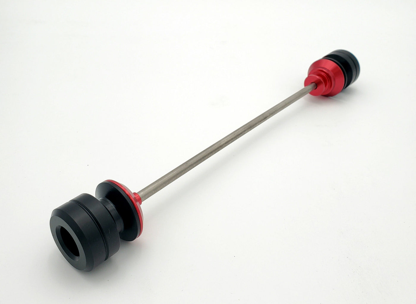 Warp 9 Ultra Bee front supermoto axle slider in red anodized — CNC machined with captive axle blocks and alignment marks
