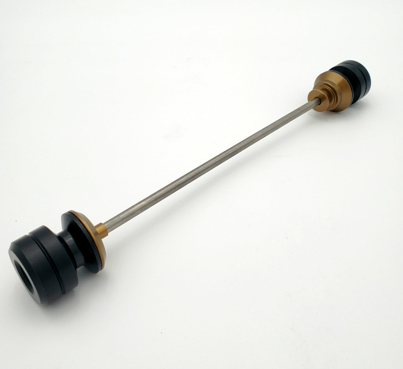 Warp 9 Ultra Bee front supermoto axle slider in magnesium anodized — CNC machined with captive axle blocks and alignment marks
