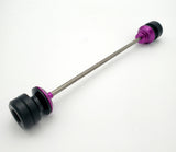 Warp 9 Ultra Bee front supermoto axle slider in purple anodized — CNC machined with captive axle blocks and alignment marks
