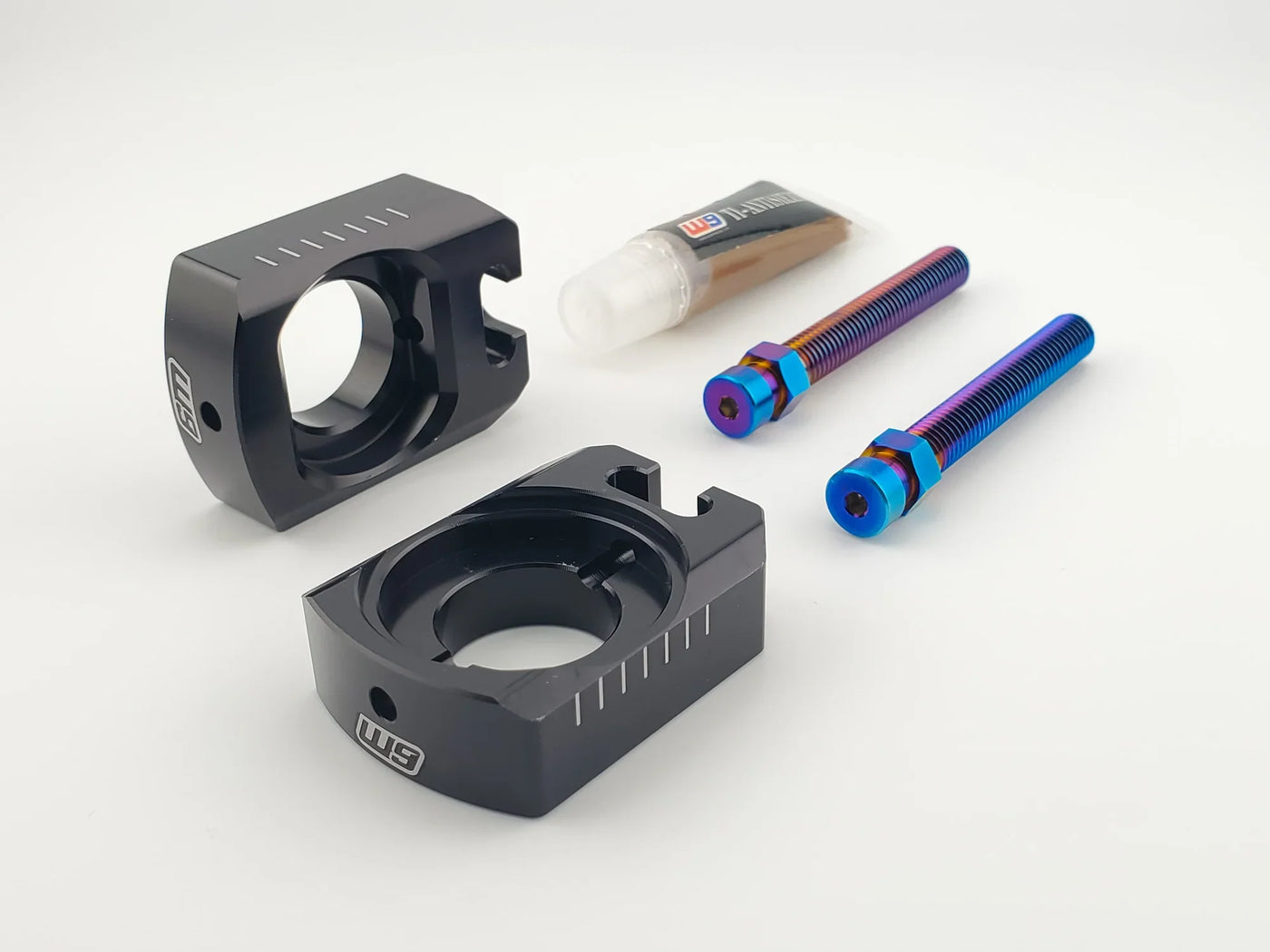 Warp 9 axle blocks for Surron Ultra Bee — CNC billet aluminum chain adjustment blocks