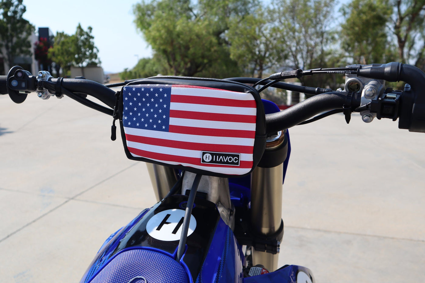 Havoc Bar Sack USA colorway mounted on electric dirt bike handlebar on the trail
