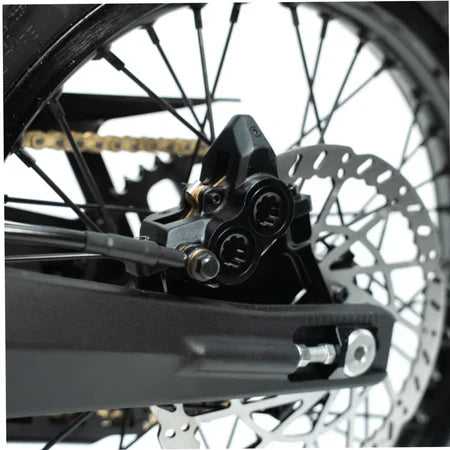 Arctic Leopard XE Pro S electric dirt bike — rear shock and swingarm detail