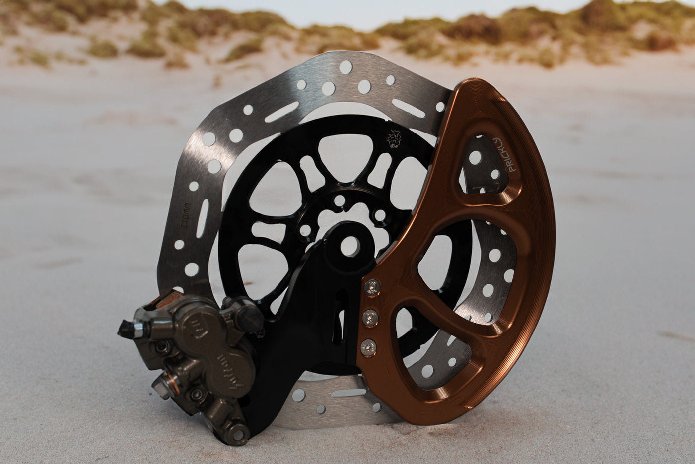 Prickly Disc Guard Fin for Surron — dorsal-fin rotor protection trail detail