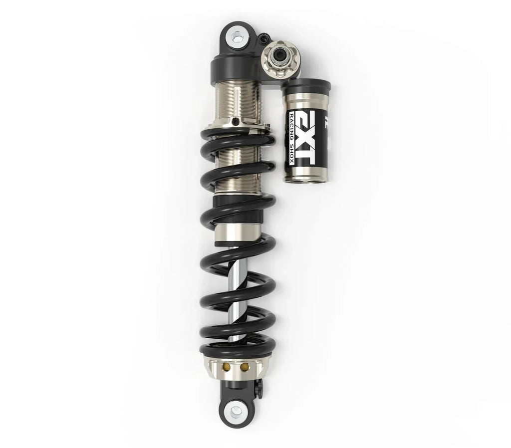 EXT Arma MX rear shock — top eyelet and spring preload adjuster close-up