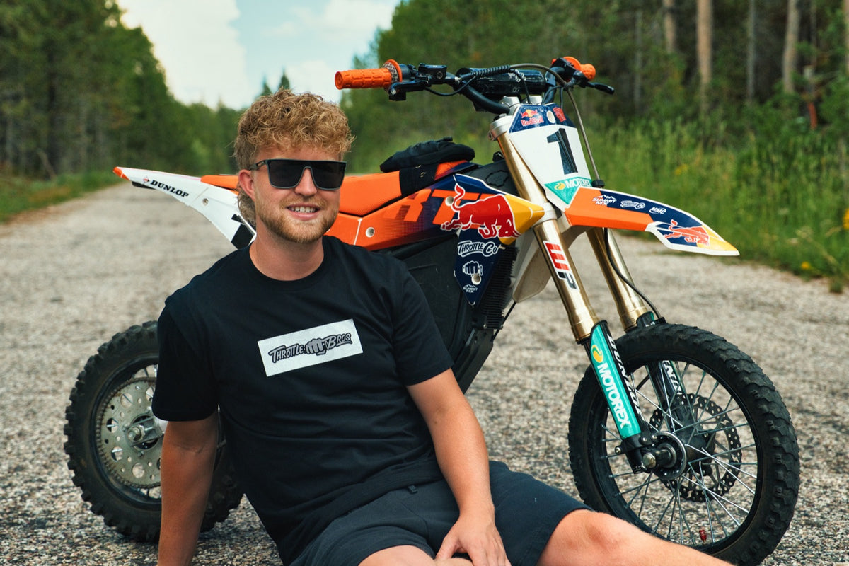 Rider in a Throttle Bros tee sitting in front of the giveaway RTR