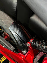 Talaria XXX carbon fiber wrap kit — applied on body panel