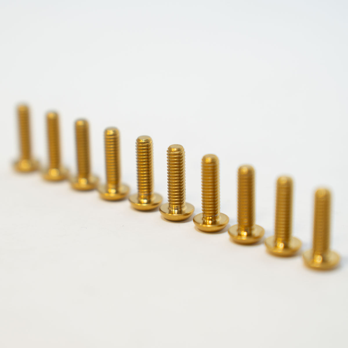Prickly titanium footpeg cleats for Surron and Talaria — boot-grip detail