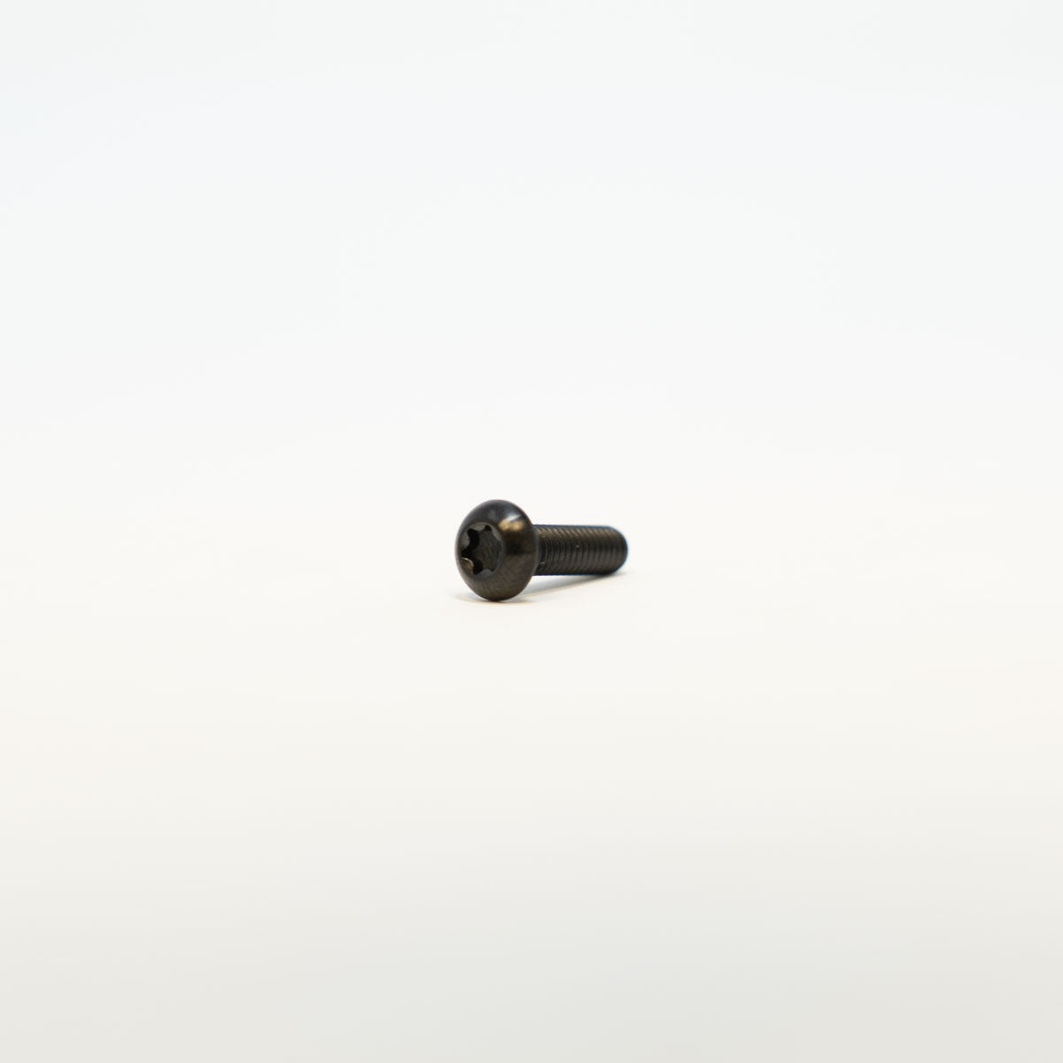 Prickly titanium footpeg pins for Surron and Talaria — color variant detail
