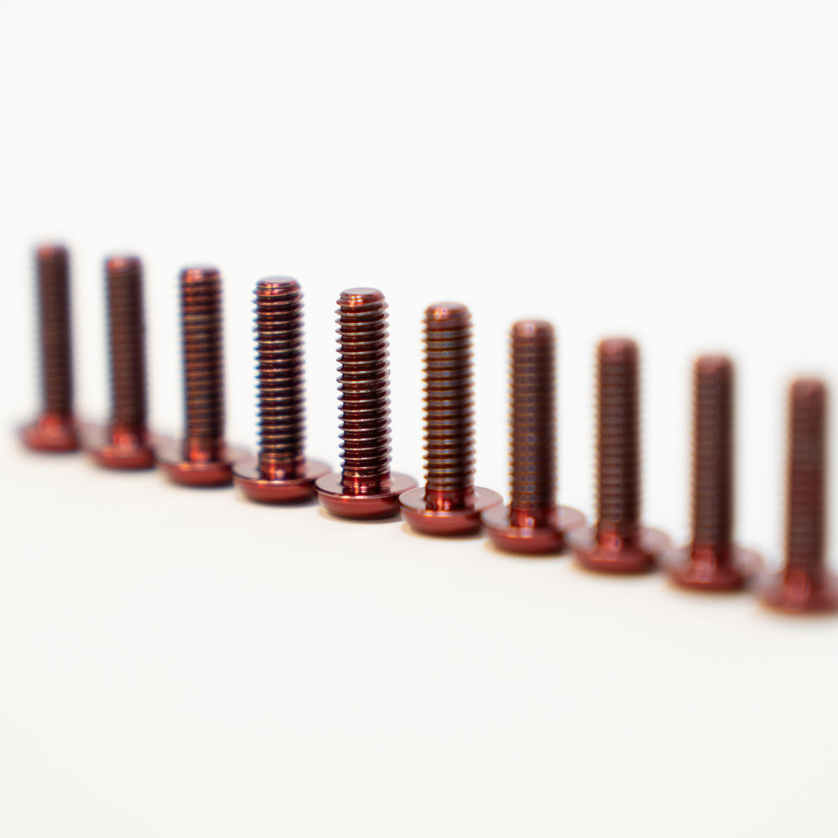Prickly titanium footpeg pins for Surron and Talaria — installed on Prickly pegs