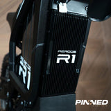 ReRode R1 electric dirt bike — rear suspension and brake disc detail