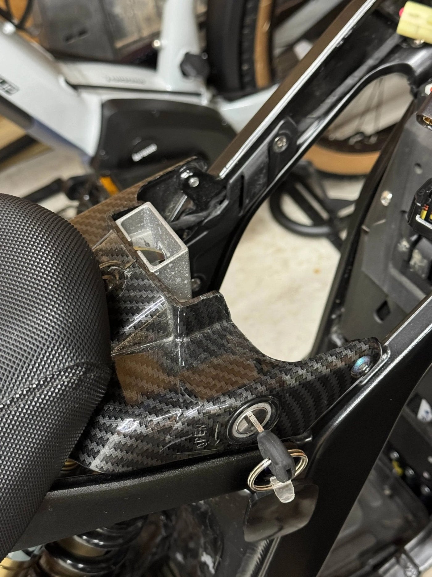 Surron Light Bee X carbon fiber wrap kit — battery panel detail
