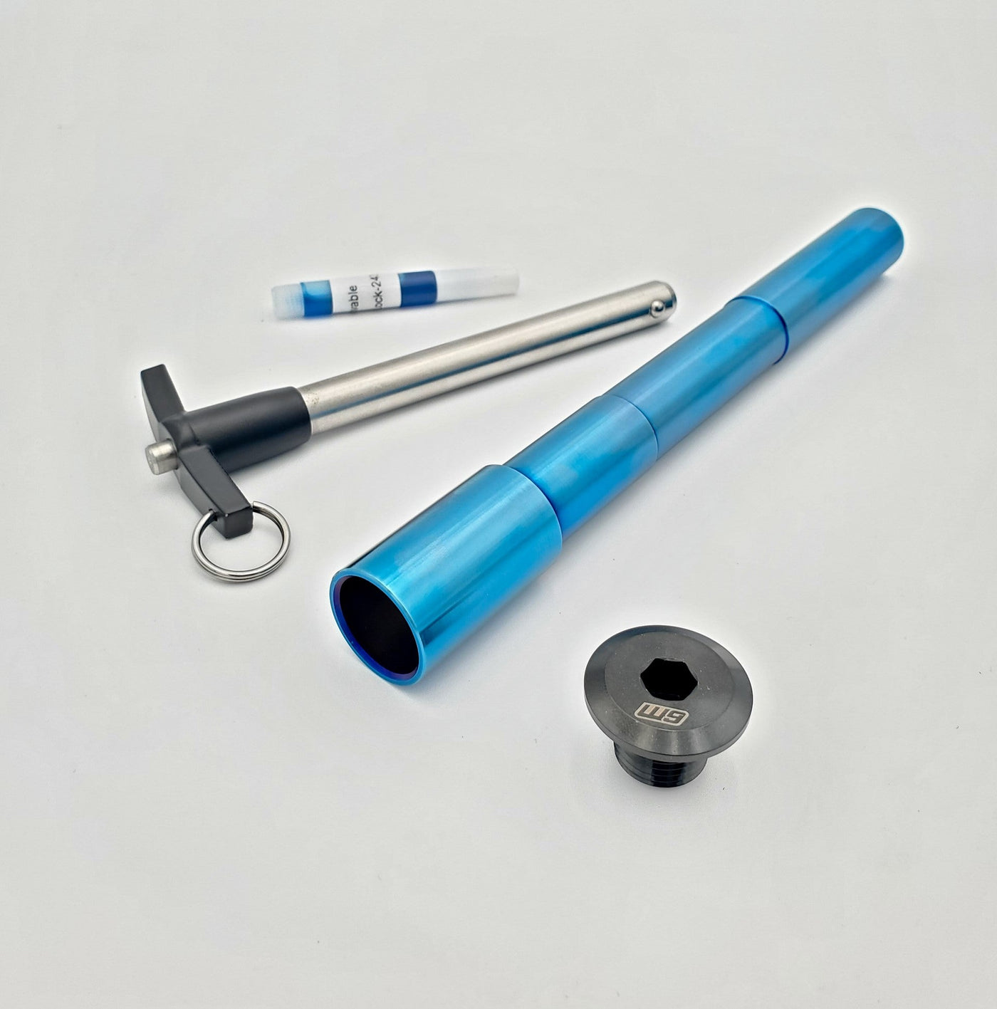 Titanium quick-pull front axle for Surron Ultra Bee — burnt blue
